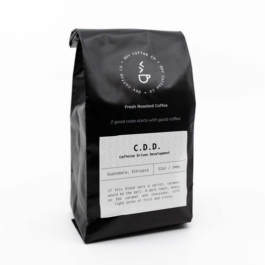 Angle of bag of 12oz "Caffeine Driven Development" Premium Coffee from Dev Coffee Co. Good code starts with good coffee.