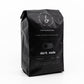Angle of bag of 12oz "Dark mode" Premium Coffee from Dev Coffee Co. Good code starts with good coffee.
